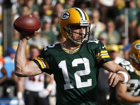 FILE - In this Sunday, Sept. 24, 2017 file photo, Green Bay Packers' Aaron Rodgers drops back during the first half of an NFL football game against the Cincinnati Bengals in Green Bay, Wis.  Rodgers probably won't have time to catch the latest installment of the blockbuster Star Wars series when "The Last Jedi" opens this weekend in theaters.  Preparing for the Carolina Panthers takes precedence as he gets ready for his first action since missing seven games with a collarbone injury.