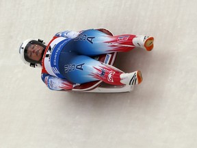 FILE - In this Dec. 16, 2017, file photo, Emily Sweeney, of the United States, takes a curve during a World Cup luge event in Lake Placid, N.Y. Sweeney is one of three members of USA Luge's women's team that is headed to Pyeongchang, South Korea, for the winter Olympics.