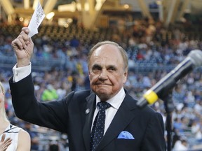 In this Sept. 29, 2016 file photo, San Diego Padres broadcaster Dick Enberg waves to the crowd at his retirement ceremony.