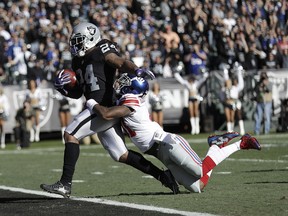 FILE - In this Dec. 3, 2017, file photo, Oakland Raiders running back Marshawn Lynch (24) scores a touchdown in front of New York Giants cornerback Dominique Rodgers-Cromartie during the first half of an NFL football game in Oakland, Calif. The Raiders face the Kansas City Chiefs this week. Lynch is coming off his first 100-yard performance of the season, and the star running back is starting to look like the Beast Mode of old.