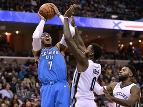 FILE - In this Dec. 9, 2017, file photo, Oklahoma City Thunder forward Carmelo Anthony (7) shoots against Memphis Grizzlies forward JaMychal Green (0) and guard Tyreke Evans (12) in the first half of an NBA basketball game, in Memphis, Tenn. Anthony returns Saturday to find a Knicks team that's moved on just fine without him.