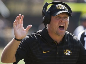 FILE - In this Sept. 16, 2017, file photo, Missouri head coach Barry Odom argues a call during the first half of an NCAA college football game against Purdue, in Columbia, Mo. After falling to 1-5 in October, Missouri coach Barry Odom set fire to all of the Tigers earlier plans and preparation. The mid-season overhaul paid off for Missouri, which won its final six games and will face Texas in the Texas Bowl on Dec. 27.