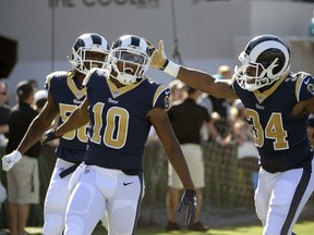 FILE - In this Oct. 15, 2017, file photo, Los Angeles Rams' Pharoh Cooper (10) celebrates his 103-yard touchdown return, on the opening kickoff, with outside linebacker Cory Littleton (58) and running back Malcolm Brown (34) during the first half of an NFL football game against the Jacksonville Jaguars, in Jacksonville, Fla. Cooper and Kansas City's Tyreek Hill split 10 of the 11 first-place votes in the AP kick returner rankings. The overall tally wasn't nearly that close, with Cooper finishing finishing 43 points ahead.