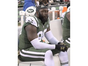FILE - In this Nov. 26, 2017, file photo, New York Jets defensive end Muhammad Wilkerson reacts while sitting on the bench during the second half of an NFL football game against the Carolina Panthers, in East Rutherford, N.J. Wilkerson has been benched for the team's game at New Orleans on Sunday. Coach Todd Bowles said Friday, Dec. 15, 2017,  that Wilkerson will not travel with the team, saying repeatedly that it was a coach's decision and he's only worried about the players who will go up against the Saints.