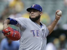 FILE - In this Sept. 24, 2017, file photo, Texas Rangers pitcher Martin Perez works against the Oakland Athletics in the first inning of a baseball game, in Oakland, Calif. Perez broke his non-pitching elbow in a mishap with a bull and is likely to miss the start of the season. Perez had surgery Monday in Dallas and is expected to start throwing in about a month. The Rangers said Tuesday, Dec. 19, 2017, the 26-year-old won't be ready for games for about four months, which could push his season debut into May. The injury occurred on Perez's ranch in his native Venezuela.