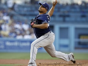 FILE - In this Aug. 12, 2017, file photo, San Diego Padres starting pitcher Jhoulys Chacin throws to the plate against the Los Angeles Dodgers during the first inning of a baseball game, in Los Angeles. The Brewers have boosted their starting rotation depth, finalizing contracts with free agent right-handers Jhoulys Chacin and Yovani Gallardo. Chacin's two-year deal and Gallardo's one-year agreement were announced by Milwaukee on Thursday, Dec. 21, 2017.