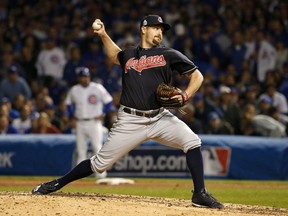 FILE - In this Oct. 28, 2016, file photo, Cleveland Indians relief pitcher Bryan Shaw throws during the seventh inning of Game 3 of the Major League Baseball World Series against the Chicago Cubs, in Chicago. Colorado finalized $27 million, three-year contracts with right-hander Bryan Shaw and lefty Jake McGee on Friday, Dec. 15, 2017, moves the Rockies hope will fortify their bullpen.
