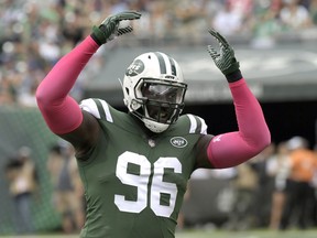 FILE - In this Sunday, Oct. 15, 2017 file photo, New York Jets defensive end Muhammad Wilkerson (96) reacts during the first half of an NFL football game against the New England Patriots in East Rutherford, N.J. New York Jets defensive end Muhammad Wilkerson was a full participant at practice after being benched at New Orleans on Sunday, Dec.17, 2017 but his playing status remains uncertain.