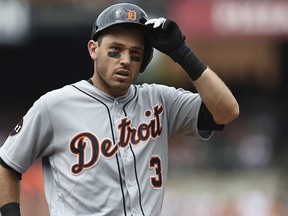 FILE - In this Sunday, Aug. 6, 2017 file photo, Detroit Tigers' Ian Kinsler removes his batting helmet after popping out with two on against the Baltimore Orioles in the fourth inning of a baseball game in Baltimore. A person with knowledge of the deal says the Detroit Tigers have agreed to trade veteran second baseman Ian Kinsler to the Los Angeles Angels for two minor leaguers, Wednesday, Dec. 13, 2017.
