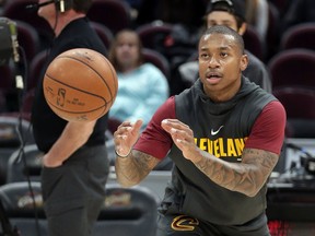 FILE - In this Nov. 22, 2017, file photo, Cleveland Cavaliers' Isaiah Thomas catches a pass before the team's NBA basketball game against the Brooklyn Nets in Cleveland. Cavaliers All-Star point guard Isaiah Thomas said he could return to the court as early as next week after being sidelined all season with a hip injury, Wednesday, Dec. 20, 2017.