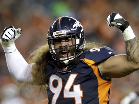 FILE - In this Oct. 15, 2017, file photo, Denver Broncos nose tackle Domata Peko reacts during the first half of an NFL football game against the New York Giants in Denver. Peko will miss his first game since 2009. The 12th-year pro was ruled of Denver's game against the Miami Dolphins because of a sprained MCL in his left knee. (AP Photo/Joe Mahoney, File)