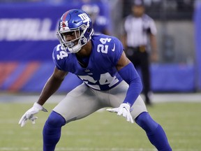 File- This Aug. 11, 2017, file photo shows New York Giants cornerback Eli Apple (24) waiting for the snap during the first quarter of an NFL football game in East Rutherford, N.J. A day after Pro Bowl safety Landon Collins referred to him as a cancer, Apple has been suspended by the New York Giants for the season finale against the Washington Redskins. The Giants announced the suspension late Wednesday, Dec. 27, 2017, after Apple had participated in the practice. Interim general manager Kevin Abrams and interim coach Steve Spagnuolo informed him of the suspension. Abrams says Apple was suspended for a "pattern of behavior that is conduct detrimental to the team."