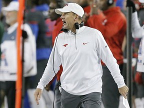 FILE - In this Nov. 19, 2016, file photo, SMU head coach Chad Morris shouts instructions from the sidelines during the first half of an NCAA college football game against  South Florida, in Dallas. A person with direct knowledge of the decision tells The Associated Press that Arkansas has hired SMU's Chad Morris to become the school's new football coach. The person spoke Tuesday night, Dec. 5, 2017, on the condition of anonymity because the decision hasn't been made public yet.