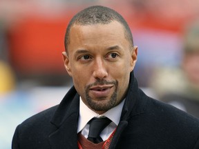 FILE - In this Nov. 19, 2017, file photo, Cleveland Browns vice president of football operations, Sashi Brown, watches before an NFL football game between the Jacksonville Jaguars and the Browns in Cleveland. A person familiar with the decisions says the Cleveland Browns have fired Sashi Brown. Brown, who was named the team's top executive by owners Dee and Jimmy Haslam during an overhaul following the 2015 season, was relieved of his duties on Thursday, Dec. 7, 2017, said the person who spoke to the Associated Press on condition of anonymity because the team has not announced the move.