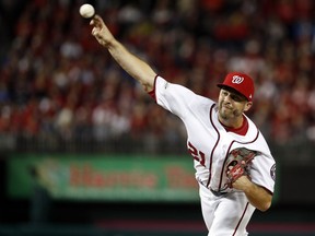 FILE - In this Thursday, Oct. 12, 2017 file photo, Washington Nationals relief pitcher Brandon Kintzler (21) throws during the sixth inning in Game 5 of baseball's National League Division Series against the Chicago Cubs, at Nationals Park  in Washington. Brandon Kintzler and the Nationals have finalized a $10 million, two-year contract that keeps the relief in Washington. Kintzler will earn $5 million next year under the deal announced Thursday, Dec. 21, 2017.