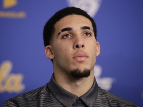 FILe -In this Wednesday, Nov. 15, 2017, file photo, UCLA NCAA college basketball player LiAngelo Ball attends a news conference at UCLA in Los Angeles. The father of UCLA guard LiAngelo Ball says he's withdrawing his son from school so he can prepare to play in the NBA. LaVar Ball says his "grand plan" is for all three sons to play for the Los Angeles Lakers. LiAngelo told "Access Hollywood" in an interview aired Tuesday, Dec. 5, 2017, on the "Today" show that his UCLA suspension is "just a long time of doing nothing. I'd rather be playing."