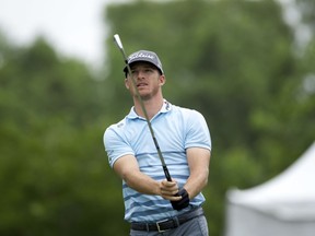 In this Sunday, April 30, 2017 file photo, Morgan Hoffmann tees off on the third hole during the final round of the PGA Zurich Classic golf tournament's new two-man team format at TPC Louisiana in Avondale, La.  Hoffmann revealed in The Players' Tribune that he has been diagnosed with muscular dystrophy that already has cost him his right pectoral muscle.