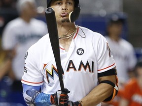 In this Thursday, Aug. 31, 2017 file photo, Miami Marlins' Giancarlo Stanton reacts after he flies out during the ninth inning of a baseball game against the Philadelphia Phillies in Miami. Giants general manager Bobby Evans confirmed on San Francisco's flagship radio station KNBR that the club has reached the parameters of a trade for Miami slugger Giancarlo Stanton. Evans spoke Wednesday, Dec. 6, 2017 of the Giants' pursuit of the Marlins star.