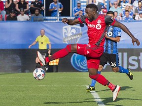 FILE - In this Sunday, Aug. 27, 2017 file photo, Toronto FC's Jozy Altidore scores against the Montreal Impact during second half MLS soccer action in Montreal. Toronto FC needs to beat the defending champion Seattle Sounders to cap their record-breaking regular season with an MLS Cup crown. Led by Altidore, fellow U.S. international Michael Bradley and 2015 league MVP Sebastian Giovinco, Toronto set a league record with 69 points this season.