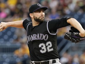 FILE - In this June 13, 2017, file phtoo, Colorado Rockies starting pitcher Tyler Chatwood delivers in the first inning of a baseball game against the Pittsburgh Penghins in Pittsburgh. Chatwood and the Chicago Cubs agreed Thursday, Dec. 7, 2017, to a $38 million, three-year contract. He gets $12.5 million in each of the next two seasons and $13 million in 2020. His 2020 salary would rise to $15 million if he is an All-Star in the previous two seasons and $17 million if he gets Cy Young consideration in the prior two years.