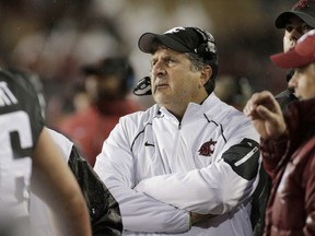 FILE - in this Oct. 21, 2017, file photo, Washington State coach Mike Leach watches from the sideline during the second half of the team's NCAA college football game against Colorado in Pullman, Wash. A person with direct knowledge of the meeting says Leach met with Tennessee athletic director John Currie to discuss the Volunteers' coaching vacancy. The person spoke to The Associated Press on condition of anonymity because neither side intended to make the meeting public. The meeting was in Los Angeles earlier Thursday, Nov. 30, and Leach was scheduled to fly back to Pullman. (AP Photo/Young Kwak, File)