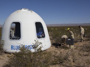 This photo provided by Blue Origin shows the New Shepard Crew Capsule 2.0 after landing in west Texas during a test on Tuesday, Dec. 12, 2017. Named after the first American in space, Alan Shepard, the spacecraft made a 10-minute suborbital flight. An instrumented test dummy was aboard, named Mannequin Skywalker. (Blue Origin via AP)