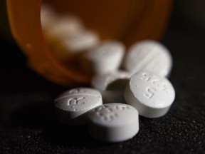 This Tuesday, Aug. 15, 2017 photo shows an arrangement of pills of the opioid oxycodone-acetaminophen in New York. Abuse of painkillers, heroin, fentanyl and other opioids across the country has resulted in tens of thousands of children being taken from their homes and placed in the foster care system.