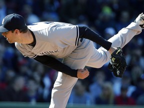 FILE - In this May 2, 2015, file photo, New York Yankees' Chris Martin pitches during the seventh inning of a baseball game against the Boston Red Sox in Boston. The Texas Rangers have finalized Martin's $4 million, two-year contract after the homegrown pitcher spent the past two seasons in Japan.