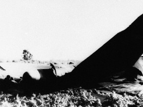 FILE - In this Jan. 17, 1966, file photo, part of the wrecked fuselage of an USAF B52 bomber lies where it crashed near Palomares, northeast of Almeria, Spain, after a collision in flight with an USAF Kc 135 tanker while refueling. Veterans who say they responded to the 1966 accident involving U.S. hydrogen bombs in Spain and then became ill from radiation exposure have asked a federal appeals court to allow a class action lawsuit against the U.S. Department of Veterans Affairs. The request was filed with the U.S. Court of Appeals for Veterans Claims on behalf of veterans who sought disability benefits from the VA but were denied. (AP Photo/File)
