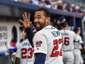 FILE - In this June 24, 2017, file photo, Atlanta Braves' Matt Kemp waves to a fan after the team's baseball game against the Milwaukee Brewers in Atlanta. Kemp is returning to the Los Angeles Dodgers as part of a five-player trade with the Atlanta Braves that includes cash.