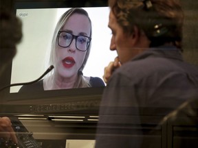 Maxine "Max" Page, a former senior editor at RadarOnline, speaks to The Associated Press via a Skype, Tuesday, Dec. 5, 2017, in New York. Page is among 12 former employees interviewed by the Associated Press, who said that Dylan Howard, a top editor for the National Enquirer, Us Weekly and other major gossip publications, openly described his sexual partners in the newsroom, discussed female employees' sex lives and forced women to watch or listen to pornographic material while he was running American Media Inc.'s Los Angeles office.