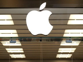 FILE - This Thursday, Sept. 19, 2013, file photo shows the Apple logo above a store location entrance in Dallas. Apple has bought Shazam, the maker of a song-recognition app that Apple's digital assistant Siri has already been using to help people identify the music playing on their iPhones.