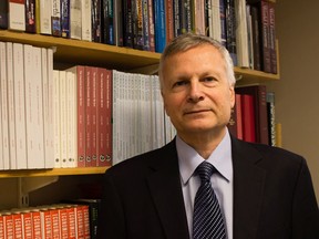 This Sept. 15, 2016, photo provided by Jessica De Simone shows author Dani Rodrik at his office at the Harvard Kennedy School in Cambridge, Mass. In Rodrik's new book, "Straight Talk on Trade: Ideas for a Sane World Economy,'' Rodrik argues that most economists long ignored what their own scholarship had made clear: That global free trade, for all its benefits, inevitably ends up depressing some industries and communities.