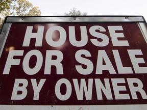 FILE - This Tuesday, Oct. 17, 2017, file photo shows a "House for Sale by Owner" sign in a yard in Fort Washington, Pa. On Wednesday, Dec. 20, 2017, the National Association of Realtors reports on sales of existing homes in November.
