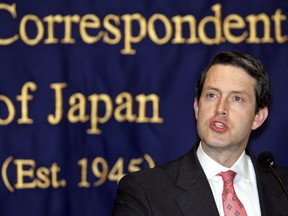 FILE - In this March 10, 2005, file photo, Randal Quarles, then-U.S. assistant secretary of Treasury, speaks to journalists in Tokyo. Quarles, who is vice chairman for supervision at the Federal Reserve, says he will recuse himself from participating in matters specific to Wells Fargo & Co. The Fed announced the decision on Friday, Dec. 15, 2017, saying Quarles wanted to "avoid even the potential appearance of a conflict of interest."