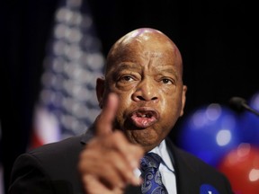 FILE- In this June 20, 2017 file photo, Rep. John Lewis, D-Ga., speaks at an election night party for Democratic candidate for 6th congressional district Jon Ossoff in Atlanta. Lewis announced Thursday, Dec. 7 that he won't speak at the opening of Mississippi civil rights and history museums on Saturday, saying it's an "insult" that President Donald Trump will attend.
