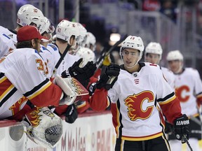 FILE - In this Nov. 20, 2017, file photo ,Calgary Flames left wing Johnny Gaudreau (13) celebrates his goal during the first period of an NHL hockey game against the Washington Capitals in Washington. Through the first two months of the season, goals are up more than 12 percent from the same time a year ago, including a 14 percent increase on the power play and a 38 percent spike short-handed.