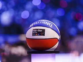 FILE - In this Feb. 14, 2015, file photo, a basketball is displayed on the court during the NBA All-Star Saturday Skills Challenge event in New York. Debuting a new NBA All-Star Game format in which players will pick teams in an effort to energize the event, the league has unveiled the voting schedule for its 2018 showcase. The players from each conference with the highest total of fan votes will serve as the captains. They will then pick from the eight remaining starters first, then choose from the pool of players voted as reserves. It could lead to some intriguing scenarios, would LeBron James pick Kyrie Irving if he's a captain? Would Russell Westbrook choose Kevin Durant?.