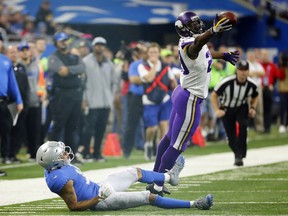 FILE - In this Thursday, Nov. 23, 2017, file photo, Minnesota Vikings cornerback Xavier Rhodes (29) intercepts a pass intended for Detroit Lions wide receiver Marvin Jones during the second half of an NFL football game in Detroit. The Vikings let cornerback Captain Munnerlyn sign with the Carolina Panthers in free agency, but their pass coverage hasn't slipped with Rhodes, Mackensie Alexander, Trae Waynes and Terence Newman helping to hold together a quality group.