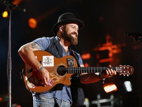 FILE - In this June 12, 2015, file photo, Zac Brown of the Zac Brown Band performs at LP Field at the CMA Music Festival in Nashville, Tenn. Three-time Grammy winners Zac Brown Band will perform the national anthem before the college football national championship game in Atlanta on Jan. 8, 2018, the College Football Playoff announced on Thursday, Dec. 14, 2017.