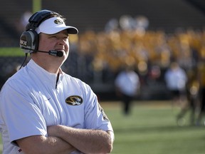 FILE - In this April 16, 2016, file photo, Missouri offensive coordinator Josh Heupel watches his team play during an NCAA college spring football game in Columbia, Mo. Heupel, who has been the offensive coordinator/quarterbacks coach at Missouri the past two seasons, was hired Tuesday, Dec. 5, 2017, as UCF's new football coach. The 39-year-old Heupel replaces Scott Frost, who accepted the Nebraska head coaching job after leading UCF to a 12-0 record and the American Athletic Conference title.