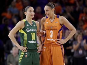 FILE - In this Sept. 6, 2017 file photo, Phoenix Mercury guard Diana Taurasi (3) talks with Seattle Storm guard Sue Bird (10) during the second half of a single-game WNBA basketball playoff matchup, in Tempe, Ariz. Bird and Taurasi headline the 29 players chosen for the U.S. women's basketball team pool. Eleven members of the 2016 Olympic team that won a sixth consecutive gold medal for the Americans are in the pool that was announced Thursday, Dec. 14.