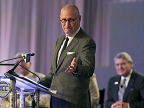 FILE - In this July 21, 2016 file photo, ESPN president John Skipper gestures as he talks about the new ACC/ESPN Network during a news conference at the Atlantic Coast Conference Football Kickoff in Charlotte, N.C. Skipper says he is resigning to take care of a substance abuse problem. The sports network says its former president, George Bodenheimer, will take over as acting head of the company for the next 90 days.