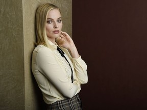 FILE - In this Dec. 5, 2017 photo, Margot Robbie, a cast member in "I, Tonya," poses for a portrait in Los Angeles. Robbie says she really wants to tie on skates and get back on the ice over the Christmas holiday. She learned to ice skate for her role as figure skater Tonya Harding but her contracts on three other films have prevented her from getting back on the blades.