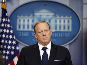FILE - In this June 20, 2017 file photo, White House press secretary Sean Spicer listens to a reporter's question during a briefing at the White House in Washington. Spicer, the former White House Press Secretary, has a book deal. Regnery Publishing, a leading conservative press, announced Tuesday that Spicer's book will come out next summer. Its working title is "The Briefing."