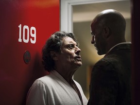 This image released by Starz shows Ian McShane, left, and Ricky Whittle in a scene from, "American Gods." A former convict is hired upon his release by a charismatic con man and finds himself in a hidden world where a battle brews between Old Gods and New Gods.