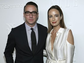 FILe - In this Sept. 6, 2017 file photo, President of E! Entertainment Adam Stotsky, left, and TV host Catt Sadler attend the ELLE, E! and IMG New York Fashion Week kick-off party in New York. Sadler, a co-host of "Daily Pop" on the E! Entertainment network, and said she's leaving after learning that on-air partner Jason Kennedy makes nearly twice as much money as she does.