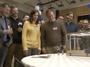 In this image released by Paramount Pictures, Kristen Wiig, center left, and Matt Damon, center right, appear in a scene from "Downsizing." (Paramount Pictures via AP)