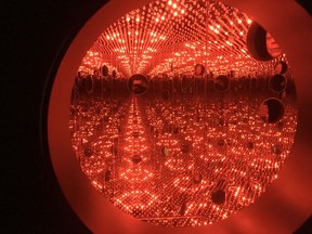 In this Nov. 21, 2017 photo, colored lights appear in the Infinity Mirror Room created by Japanese artist Yayoi Kusama, part of the exhibit, "Yayoi Kusama: Festival of Life," on display at the David Zwirner gallery in the Chelsea section of New York. The exhibit runs through Dec. 16.