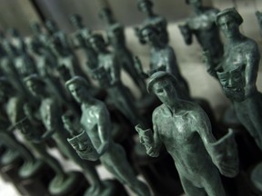 FILE - This Jan. 17, 2017 file photo shows solid bronze Actor statuettes for the Screen Actors Guild awards displayed at the American Fine Arts Foundry in Burbank, Calif. The SAG Awards nominations for achievements in film and television will be announced on Wednesday, Dec. 13.